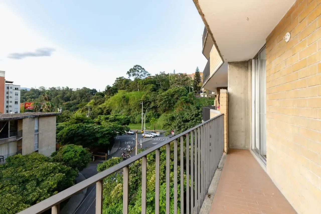 The balcony above the wooded ravine beside the building