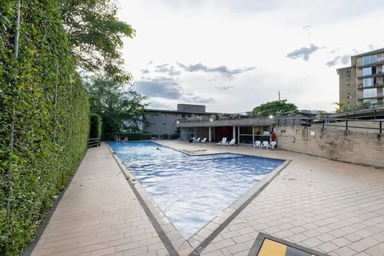 The building's pool, hedged and open to the sky
