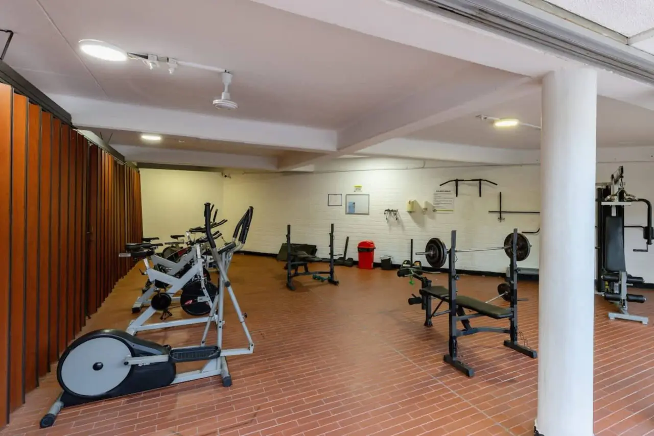 The building's gym, with weights and cardio machines
