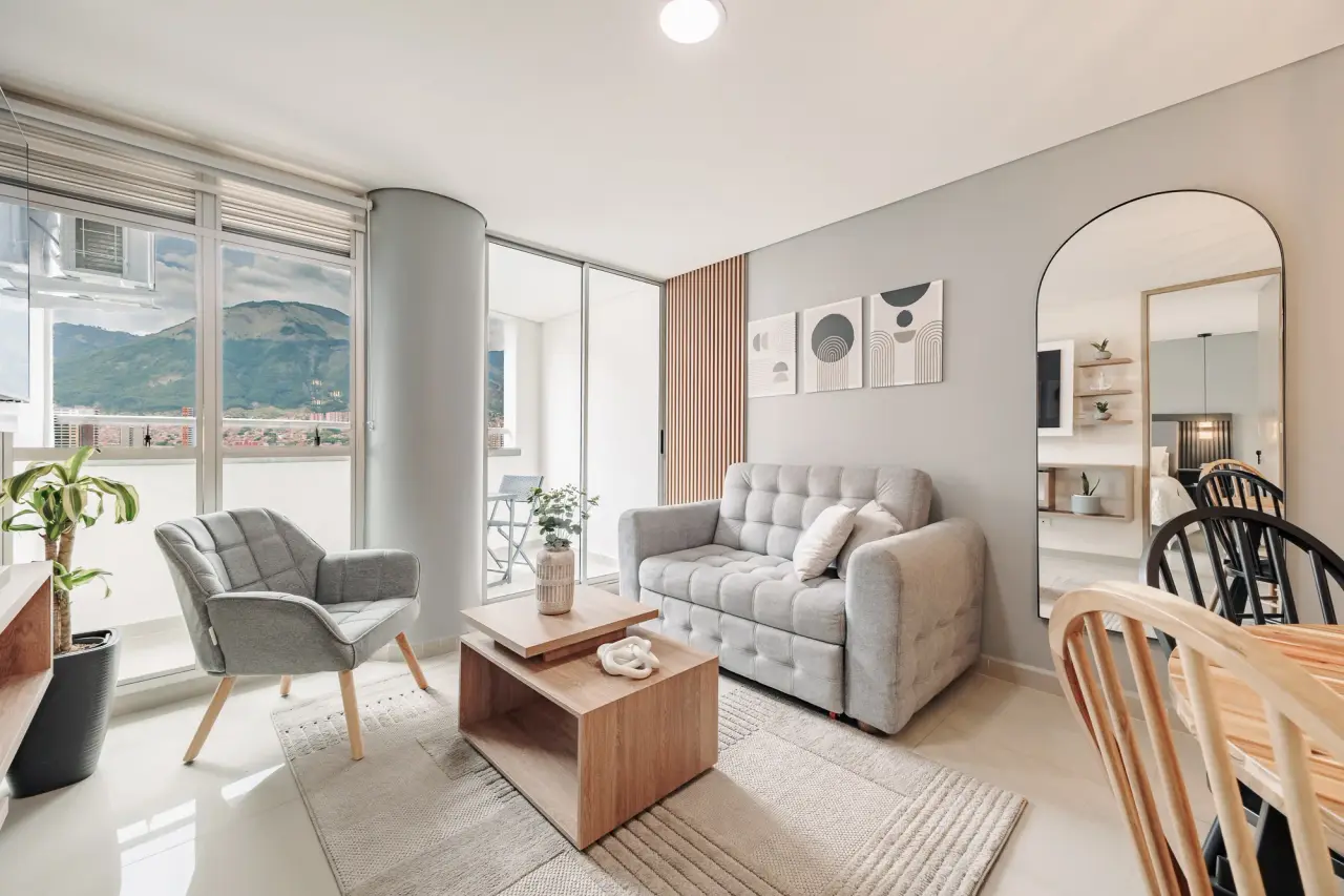 Bright living room with a mountain view through floor-to-ceiling windows at Casa Roble