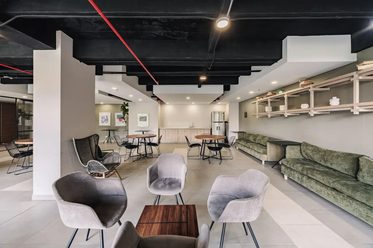 Social lounge in the complex with a kitchen, tables and sofas
