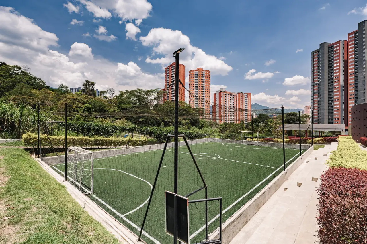 Synthetic sports field at the foot of the towers